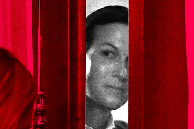 Jared Kushner looks into a room through a partially closed door.